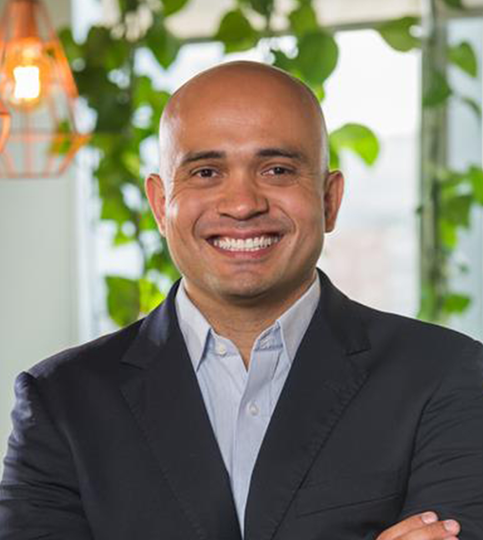 image of team in front of company building (for a roofing contractor)